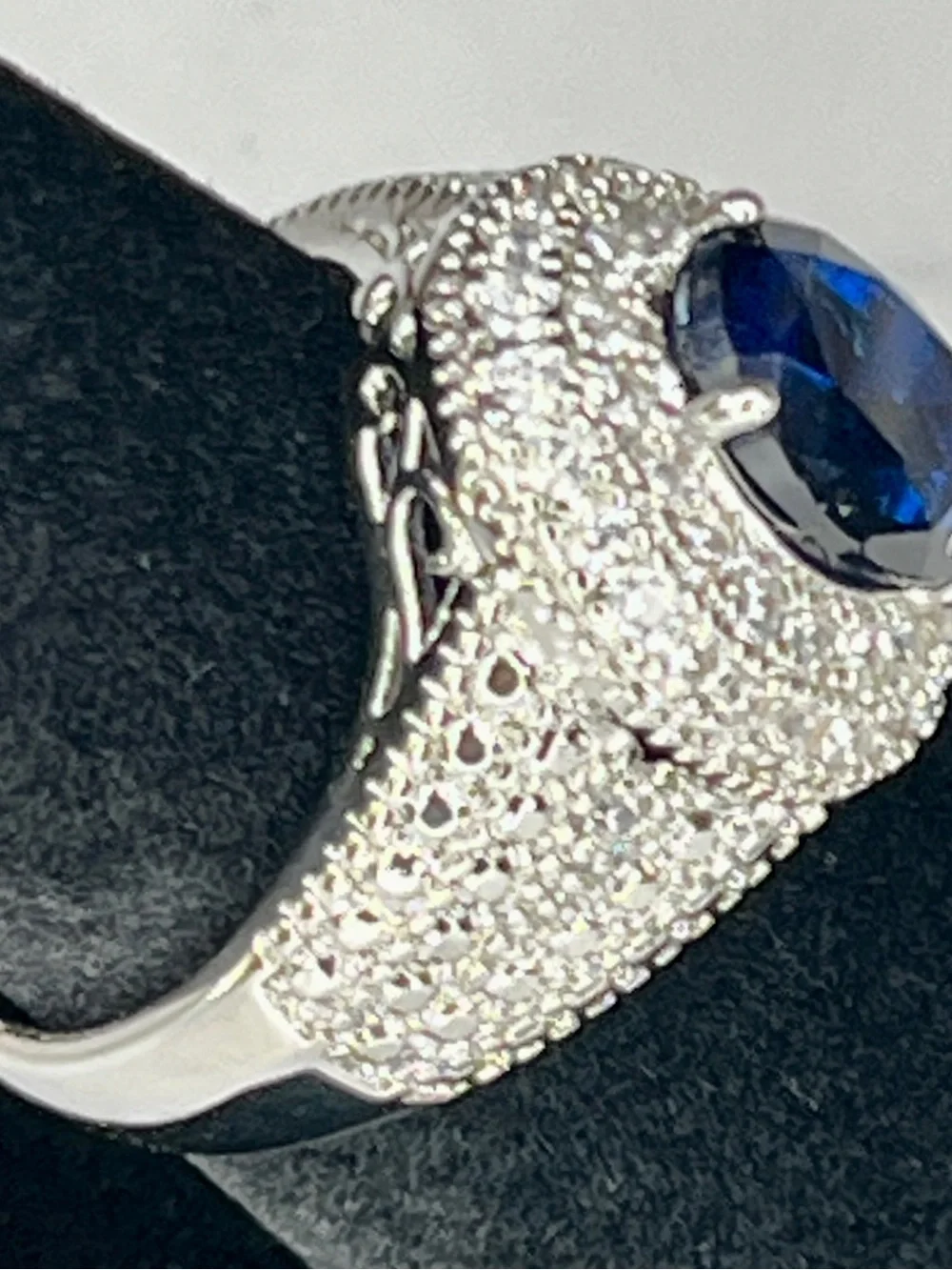 Elegant Silver Ring with Deep Blue Oval Center Stone